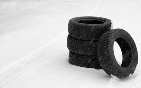 New winter tires on fresh snow. Space for textの写真素材