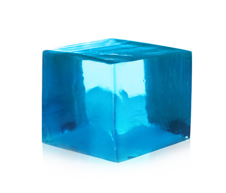 Delicious blue jelly cube on white backgroundの写真素材