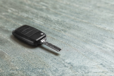 Car key on gray background. Space for textの写真素材