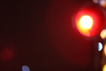 Blurred view of beautiful lights on dark background. bokeh effect
