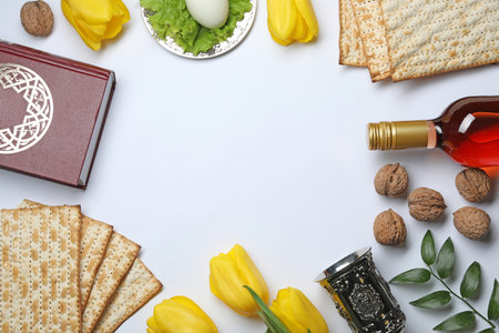 Flat lay composition with symbolic Passover (Pesach) items on white background, space for textの写真素材