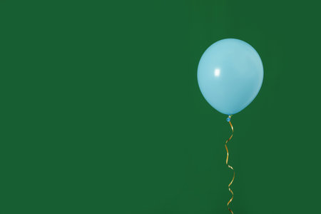 Bright balloon on color background, space for text. Celebration timeの写真素材