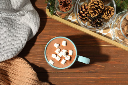 Flat lay composition with cup of cocoa on wooden background. winter drinkの写真素材