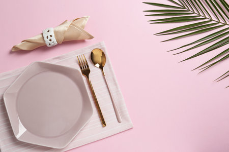 Stylish elegant table setting on color background, top view. Space for textの写真素材