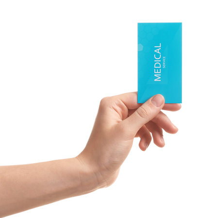 Woman holding business card isolated on white, closeup. medical serviceの写真素材