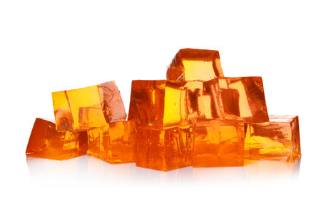 Pile of tasty jelly cubes isolated on whiteの写真素材