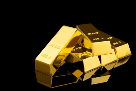 Shiny gold bars on black background. Space for textの写真素材