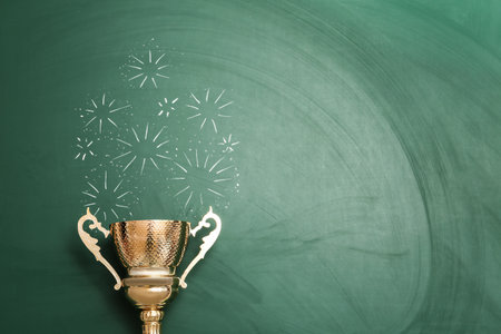 Trophy and chalk drawn salute on color background, space for text. Victory concept