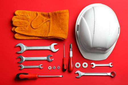 Flat lay composition with construction tools on color backgroundの写真素材