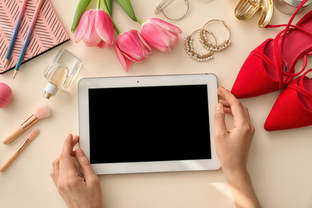 Beauty blogger with tablet at table, top viewの写真素材