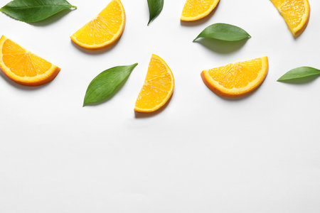 Composition with orange slices on white background, top viewの写真素材