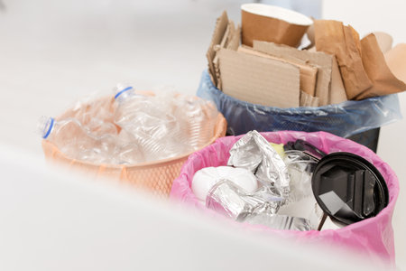 Trash cans full of garbage indoors, closeup. Waste recyclingの写真素材