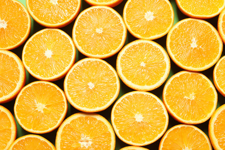 Halves of ripe oranges as background, top viewの写真素材