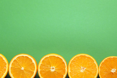 Flat lay composition with ripe oranges and space for text on color backgroundの写真素材