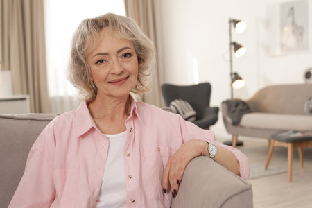Portrait of mature woman in living room