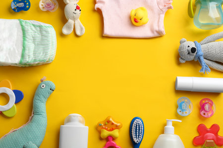 Flat lay composition with baby accessories and space for text on color backgroundの写真素材