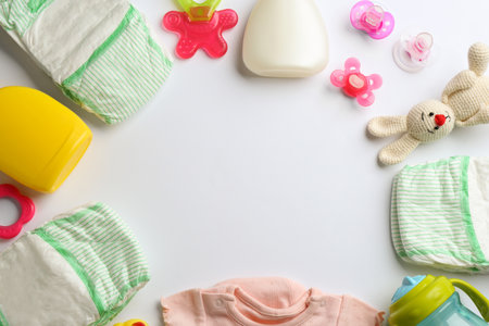 Flat lay composition with baby accessories and space for text on white backgroundの写真素材