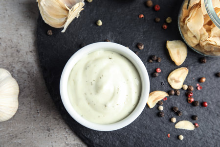 Flat lay composition with garlic sauce on gray backgroundの写真素材