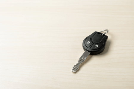 Car key on wooden background. Space for textの写真素材