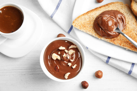 Sweet chocolate mousse served with coffee on wooden table, flat layの写真素材