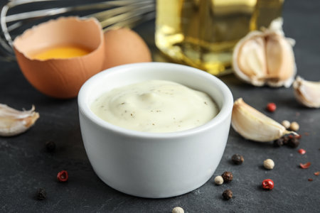 Bowl of garlic sauce on kitchen tableの写真素材