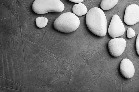 Zen stones on dark background, top view with space for textの写真素材