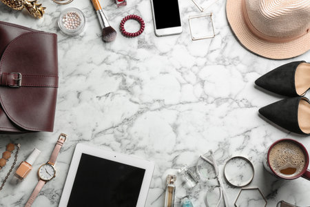 Flat lay composition with devices, blogger's stuff and space for text on marble backgroundの写真素材