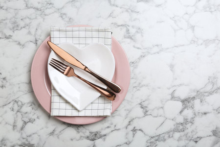 Stylish elegant table setting on marble background, top view. Space for textの写真素材
