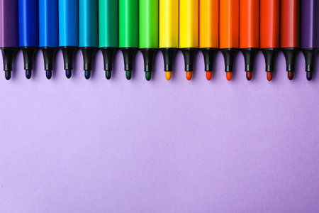 Flat lay composition with markers and space for text on color background. rainbow paletteの写真素材