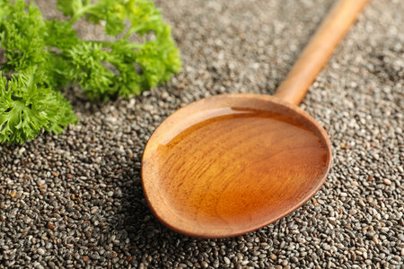Spoon with chia oil on seeds, closeupの写真素材