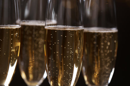 Glasses of champagne on dark background, closeupの写真素材