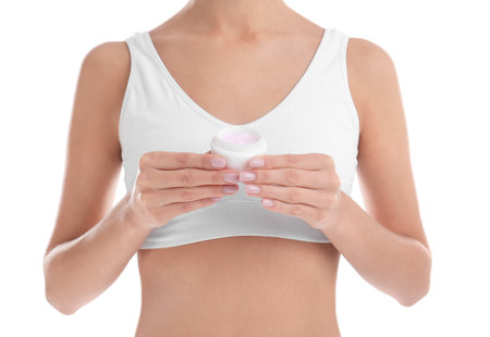 Young woman with jar of cream on white background, closeup. beauty and body careの写真素材
