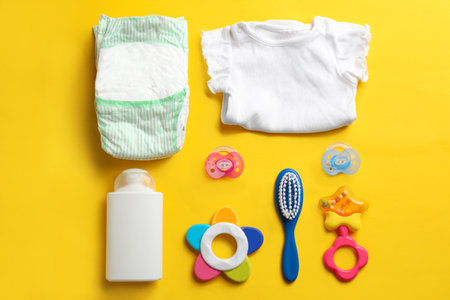 Flat lay composition with baby accessories on color backgroundの写真素材