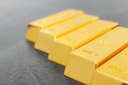 Shiny gold bars on gray background, closeupの写真素材