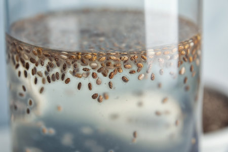 Glass of water with chia seeds, closeupの写真素材
