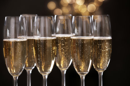Many glasses of champagne on blurred background, closeupの写真素材