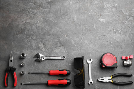 Flat lay composition with construction tools on gray background, space for textの写真素材