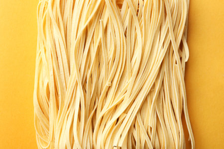 Block of quick cooking noodles on color background, top viewの写真素材