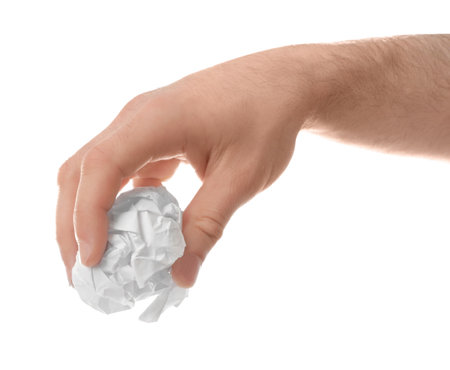 Man crumpling paper against white background, closeup. Generating ideasの写真素材