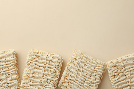 Flat lay composition with quick cooking noodles on color background. Space for textの写真素材