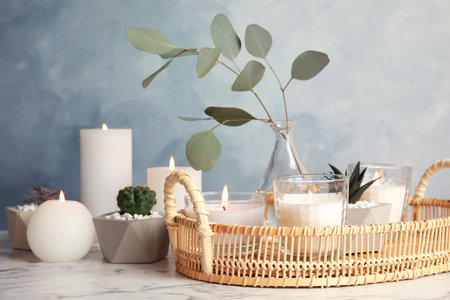 Beautiful composition with burning candles on tableの写真素材
