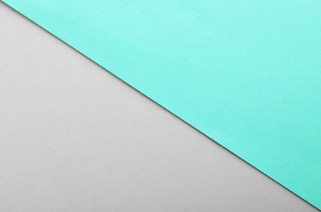 Turquoise and gray paper sheets as colorful background, top viewの写真素材