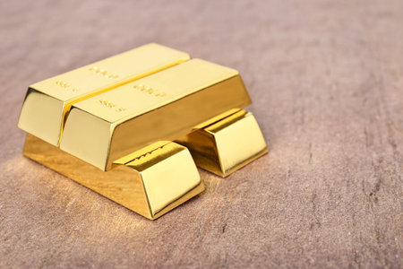 Shiny gold bars on table. Space for textの写真素材