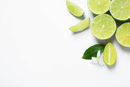 Fresh limes on white background, top view. Citrus fruitsの写真素材