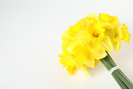 Bouquet of daffodils on white background, top view. Fresh spring flowersの写真素材