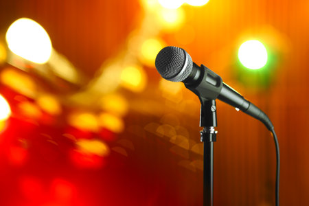 Microphone against festive lights, space for textの写真素材
