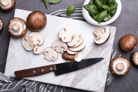 Flat lay composition with fresh raw mushrooms on tableの写真素材
