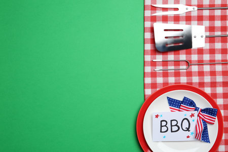 Set of dishware and barbecue tools on color background, flat lay with space for text. USA Independence Dayの写真素材
