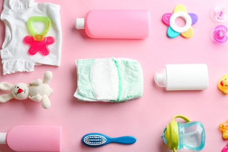 Flat lay composition with baby accessories on color backgroundの写真素材