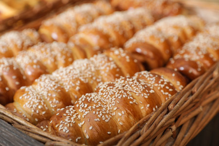 Wicker tray with tasty fresh buns, closeup. bakery productsの写真素材